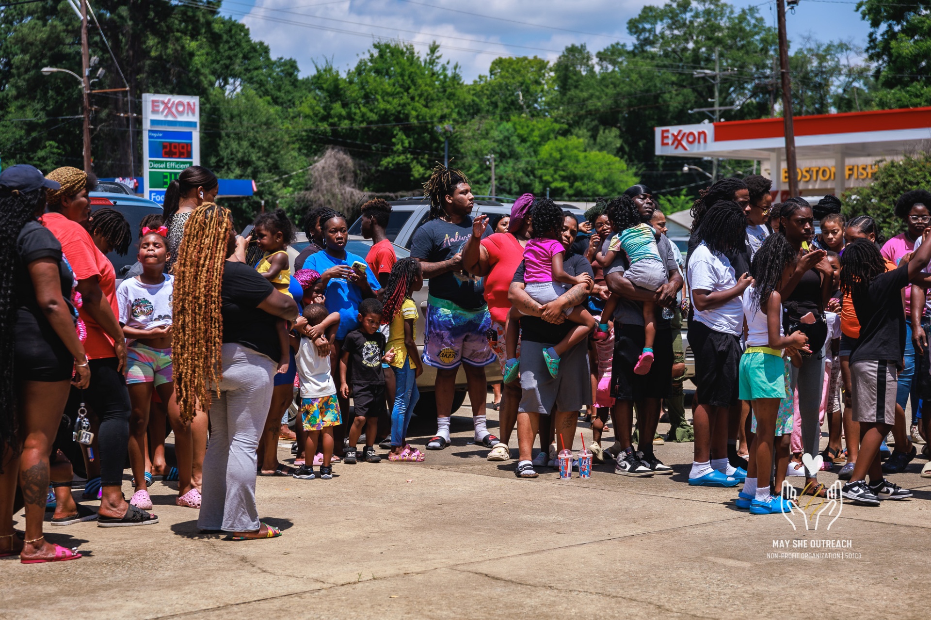 Crowd gathered for a May She Outreach community giveback